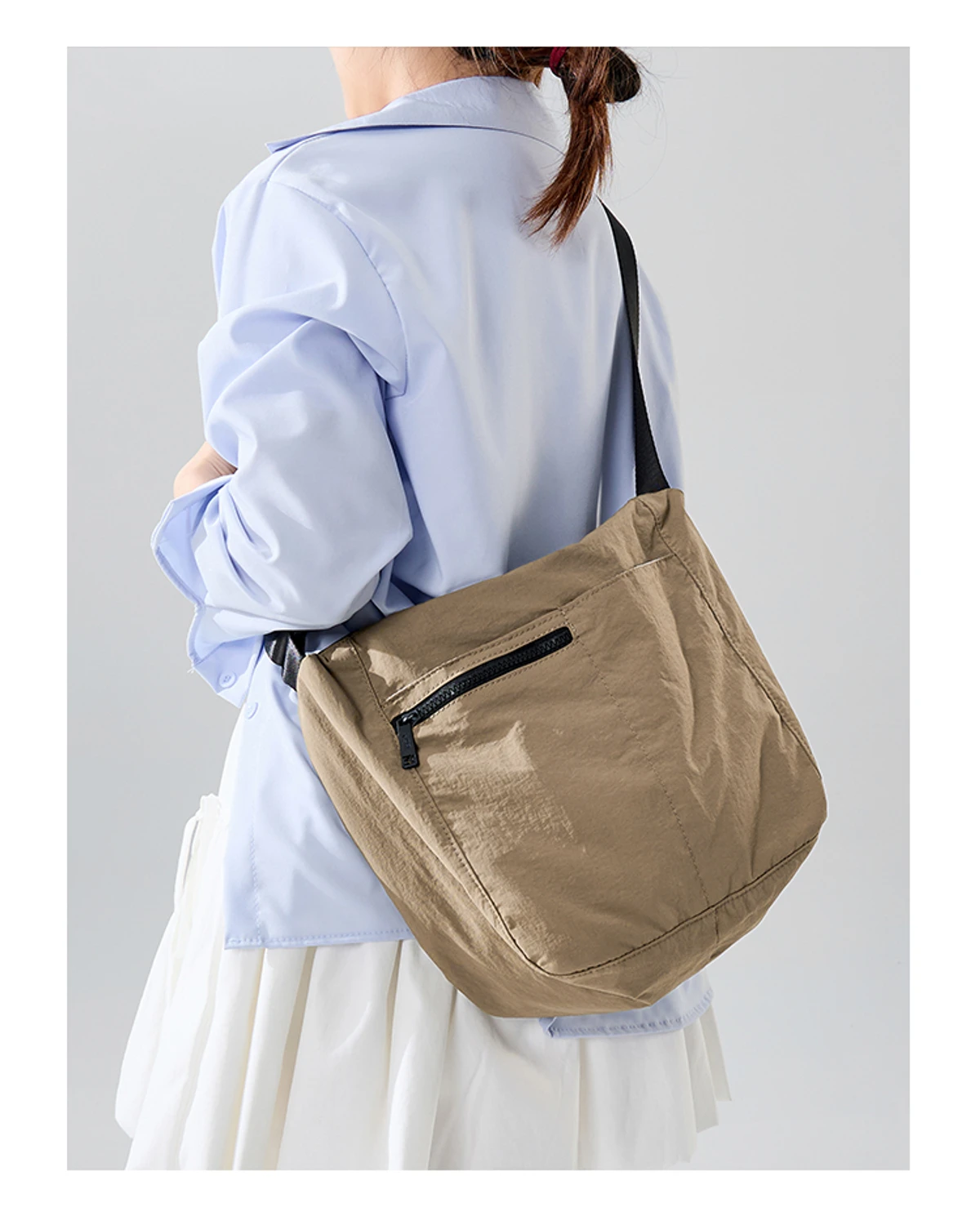 Khaki MG5004 three-pocket crossbody bag worn over the shoulder