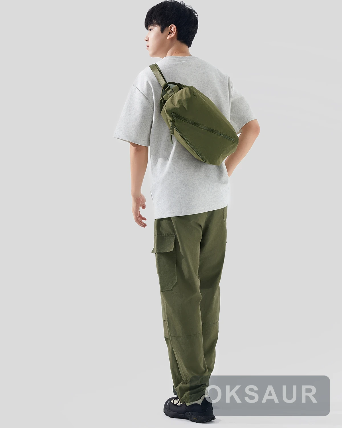 Olive square sports bag worn across the body