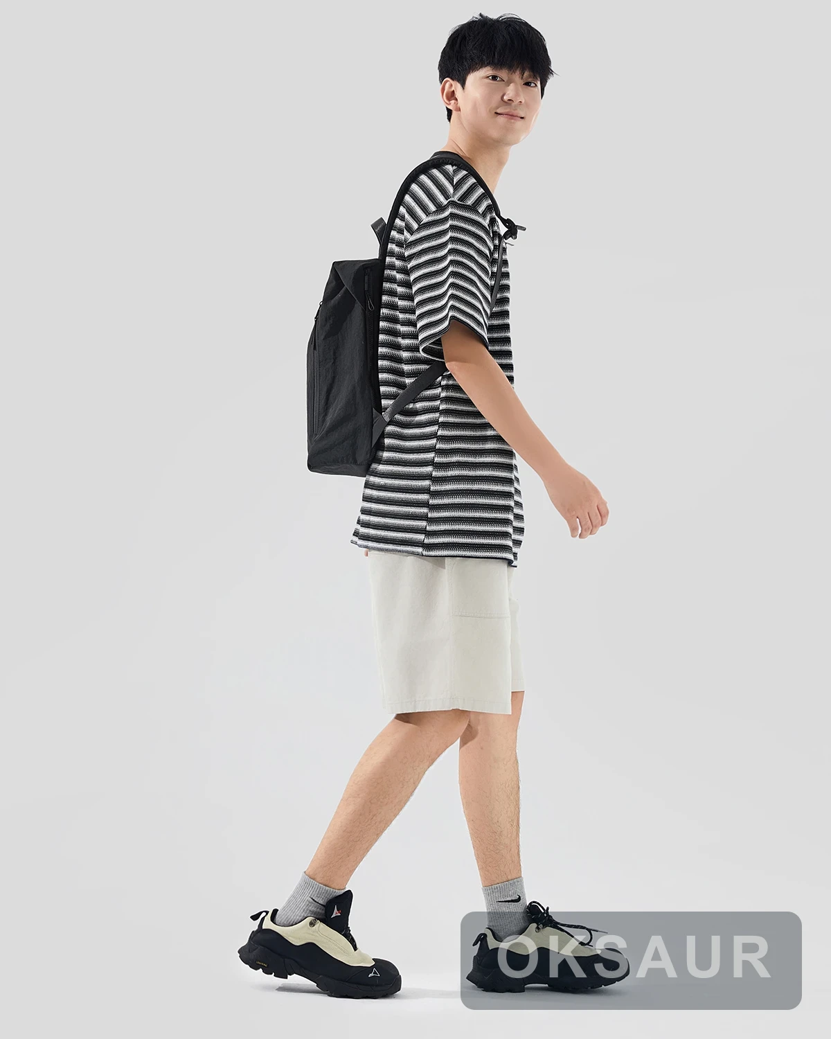 Black lightweight backpack shown from the side