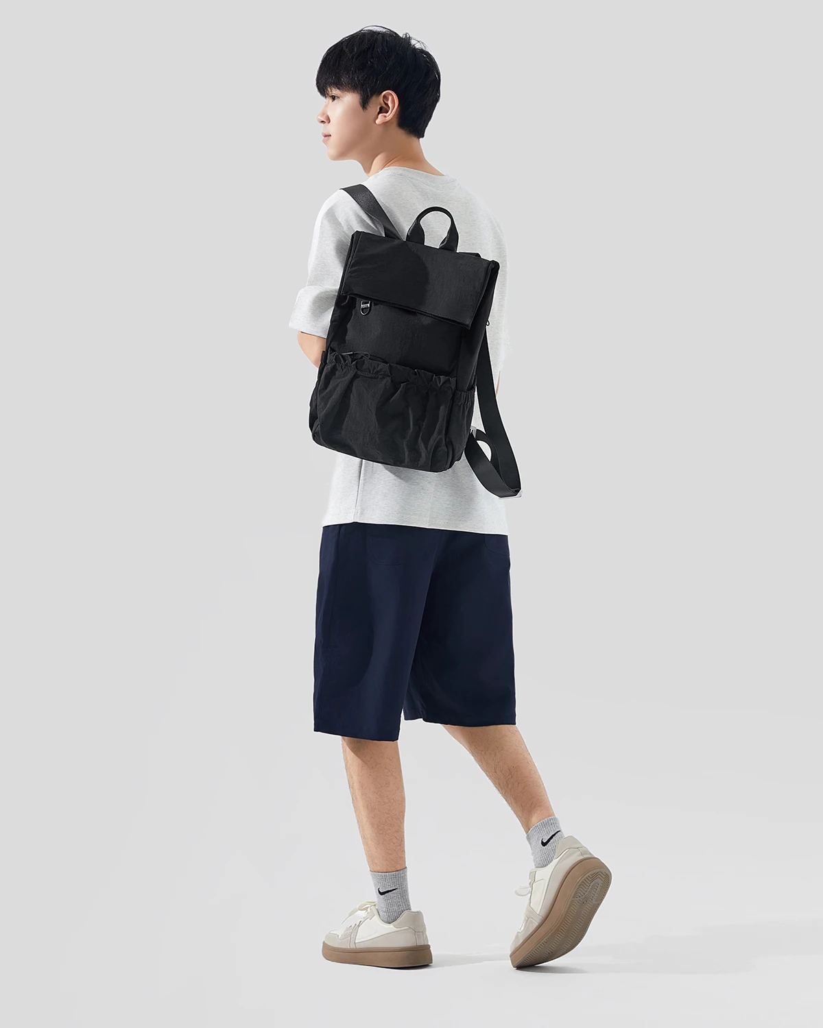 Black pocket backpack worn on a model