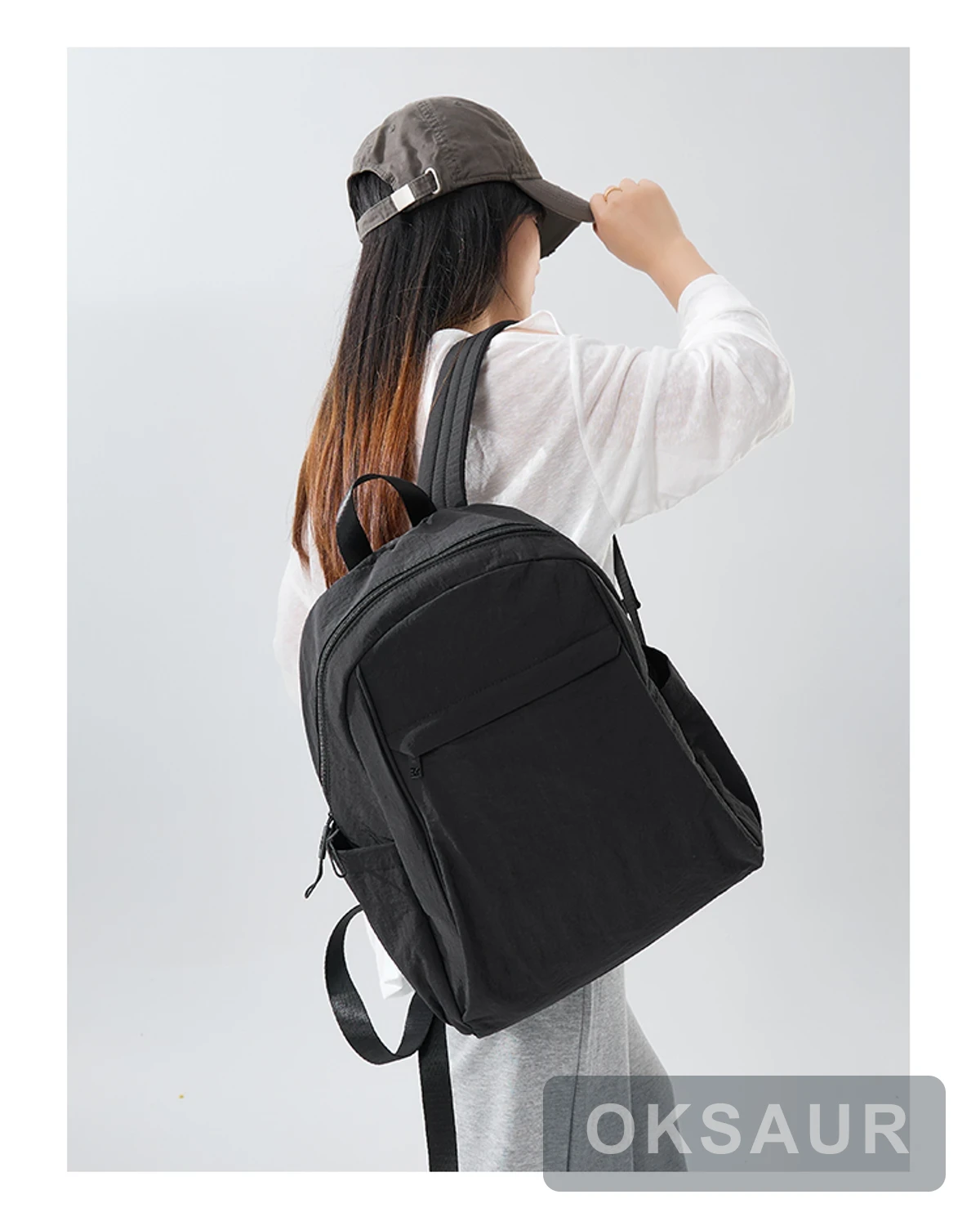 Black large-capacity backpack worn on a model