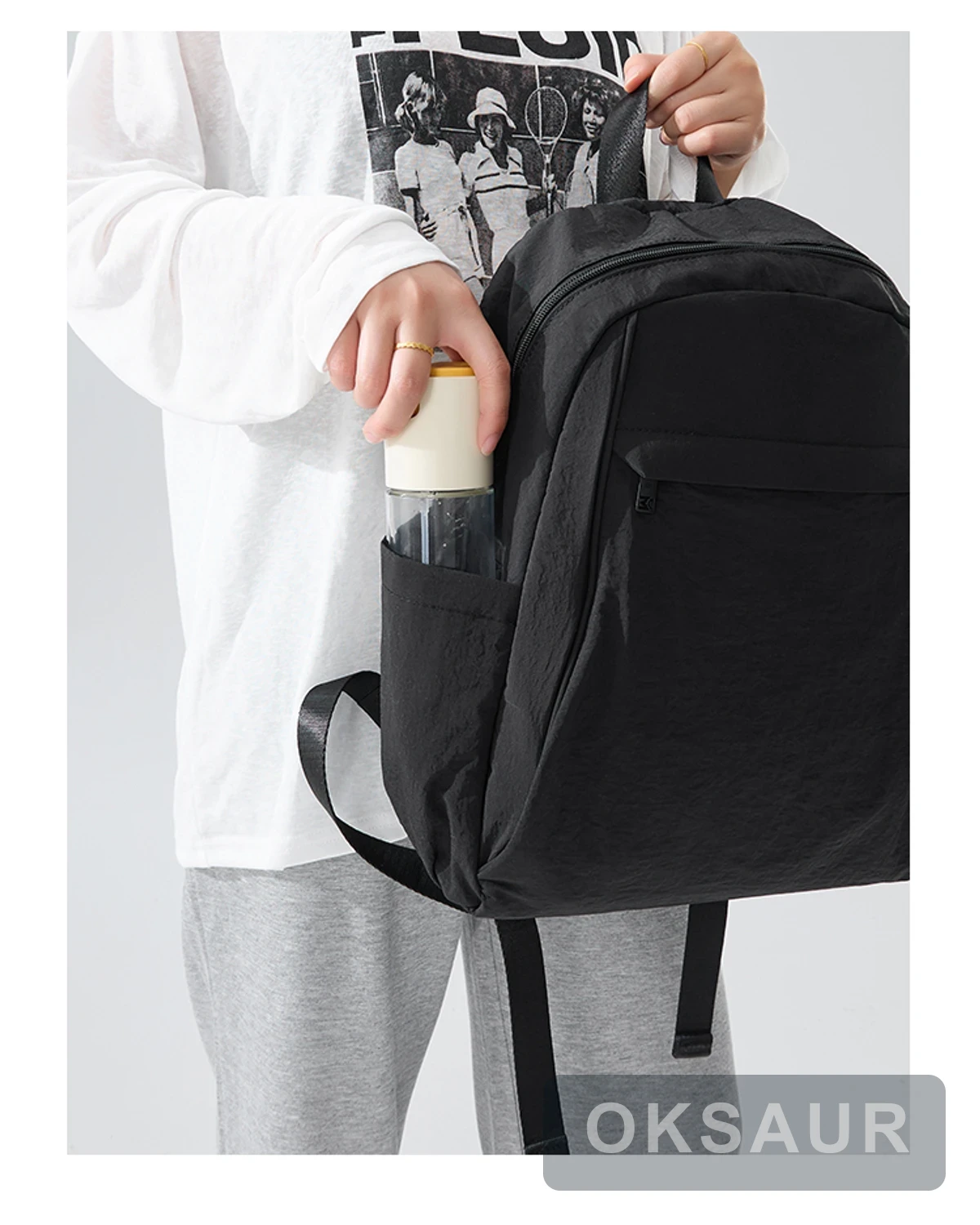 Black large-capacity backpack with a side bottle pocket