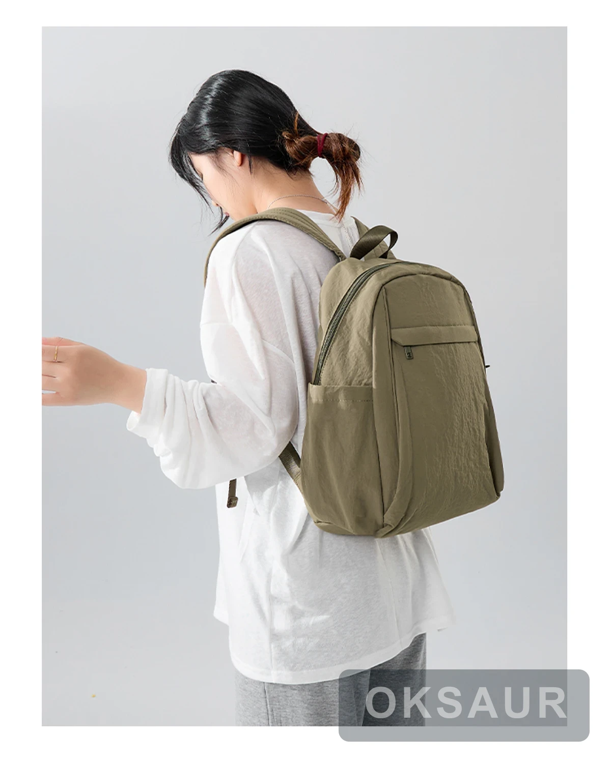 Khaki large-capacity backpack shown from the side